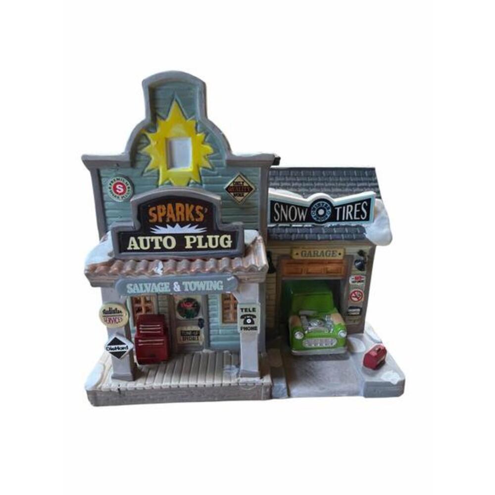 Retired Lemax Spark's Auto Plug lighted building from the Holidays & Seasons vil